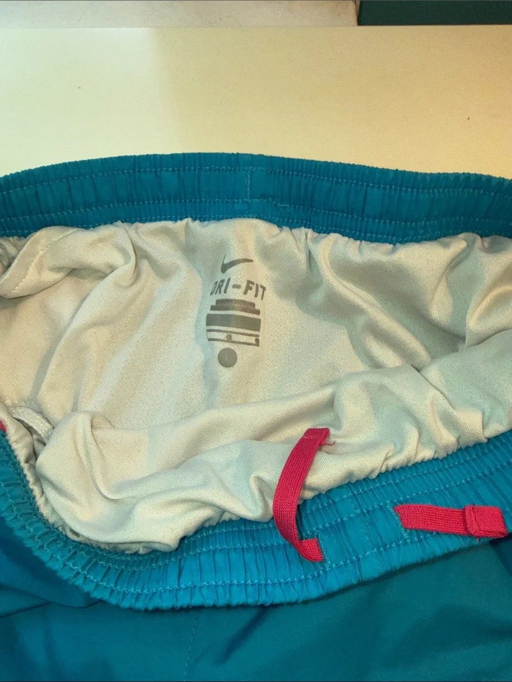 Nike Women’s Turquoise Athletic Shorts with Pink Trim